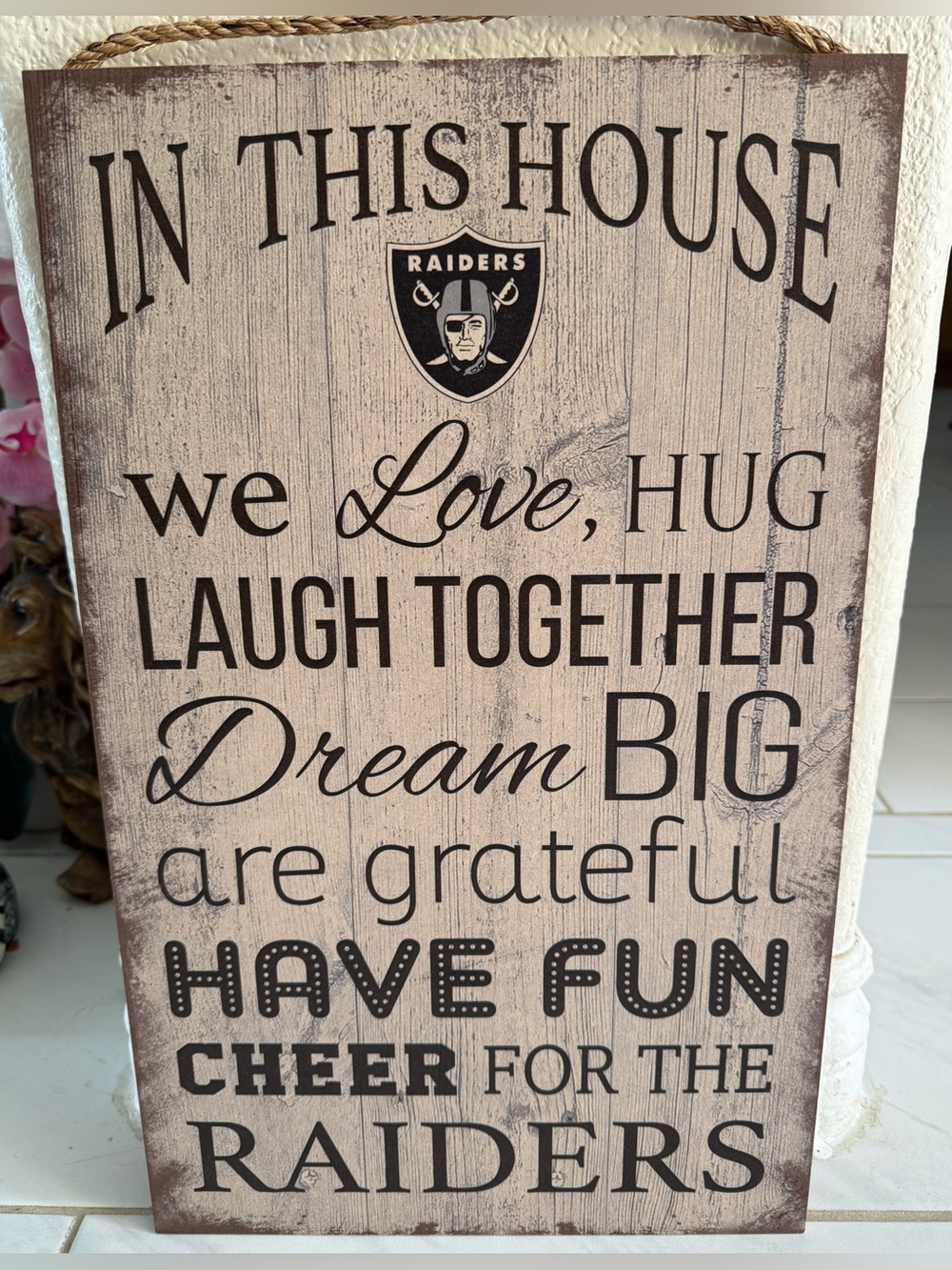 Raiders : In This House ~ Wood Grain Wall Sign in Beige and Black 11”x19” NWOT